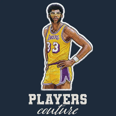 Kareem Abdul Jabbar Badge Men's Hoodie – navy close-up detail shot of the Kareem Abdul Jabbar Players Couture logo design