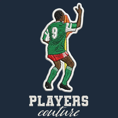 Roger Milla Badge Men's Hoodie – navy close-up detail shot of the Roger Milla Players Couture logo design