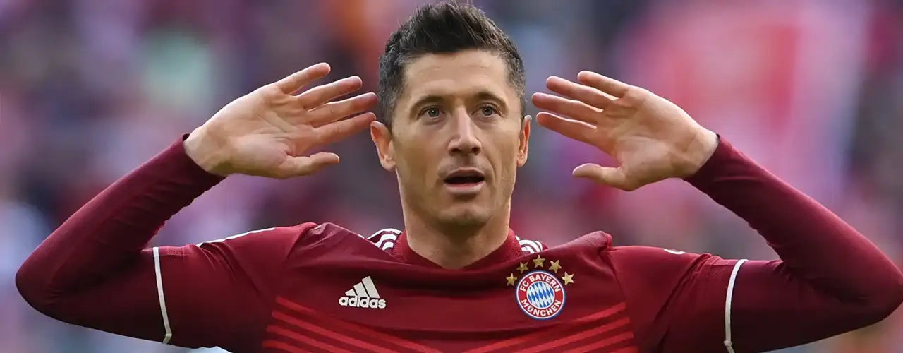 Soccer player in Bayern Munich jersey celebrating on field, premium sports fashion inspiration
