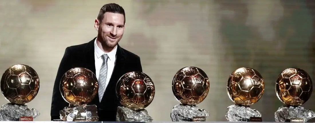 Soccer star in black suit with six Ballon d'Or trophies, sports fashion inspiration