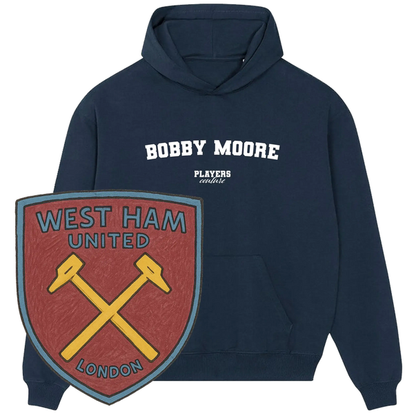 Navy Players Couture Bobby Moore hoodie with West Ham United London crest, premium sportswear.
