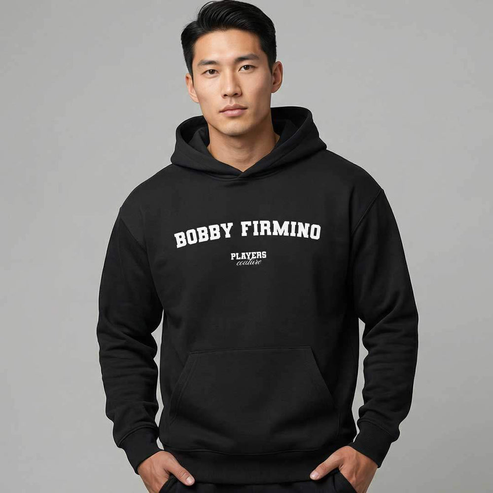 Man wearing black Players Couture Bobby Firmino men's casual hoodie, sports fashion