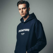 Man wearing navy Players Couture Champions hoodie, premium men's sports fashion apparel