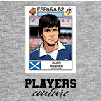 Alan Hansen World Cup Sticker Men's T-Shirt – grey close-up detail shot of the Alan Hansen World Cup Players Couture logo