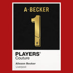 Alisson Becker 1 Football Shirt Frame Men's Hoodie – red close-up detail shot of the Alisson Becker Players Couture logo