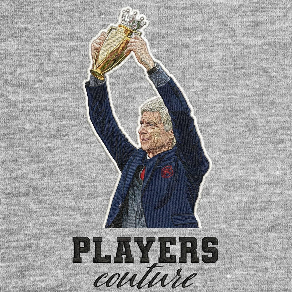 Arsene Wenger Badge Men's Hoodie – grey close-up detail shot of the Arsene Wenger Players Couture logo design