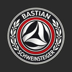 Bastian Schweinsteiger Logo Men's T-Shirt – black close-up detail shot of the Bastian Schweinsteiger Players Couture logo