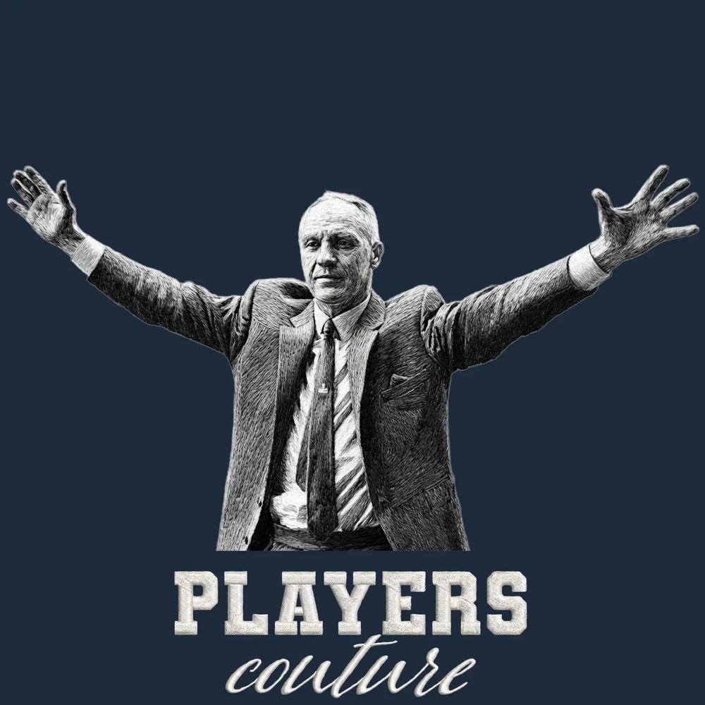 Bill Shankly Embrace Badge Men's T-Shirt – navy close-up detail shot of the Bill Shankly Embrace Players Couture logo design