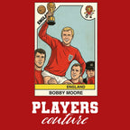 Bobby Moore World Cup Sticker Men's T-Shirt – red close-up detail shot of the Bobby Moore World Cup Players Couture logo