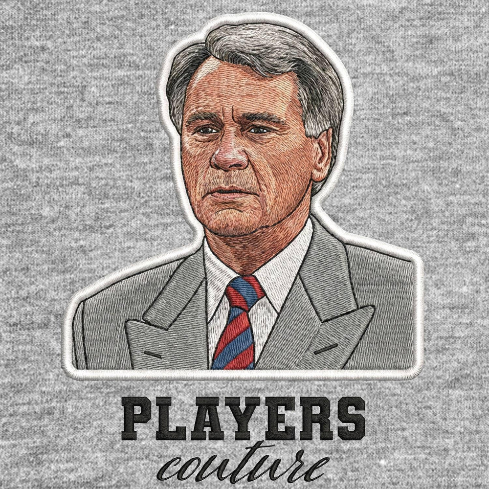 Bobby Robson Badge Men's T-Shirt – grey close-up detail shot of the Bobby Robson Players Couture logo design