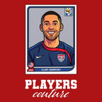 Clint Dempsey World Cup Sticker Men's T-Shirt – red close-up detail shot of the Clint Dempsey World Cup Players Couture logo