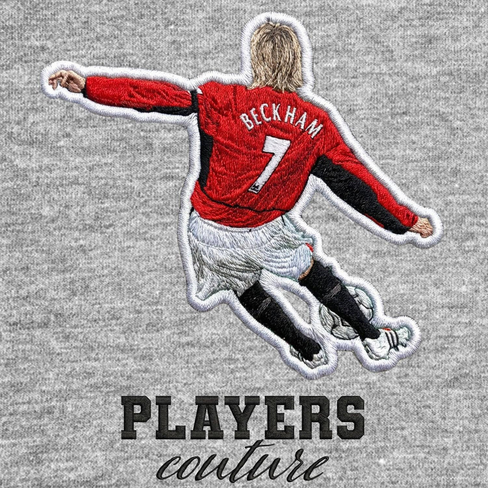 David Beckham Man Utd Badge Men's T-Shirt – grey close-up detail shot of the David Beckham Man Utd Players Couture logo