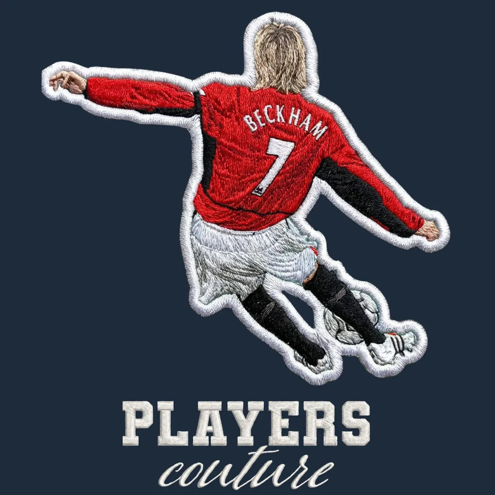 David Beckham Man Utd Badge Men's T-Shirt – navy close-up detail shot of the David Beckham Man Utd Players Couture logo