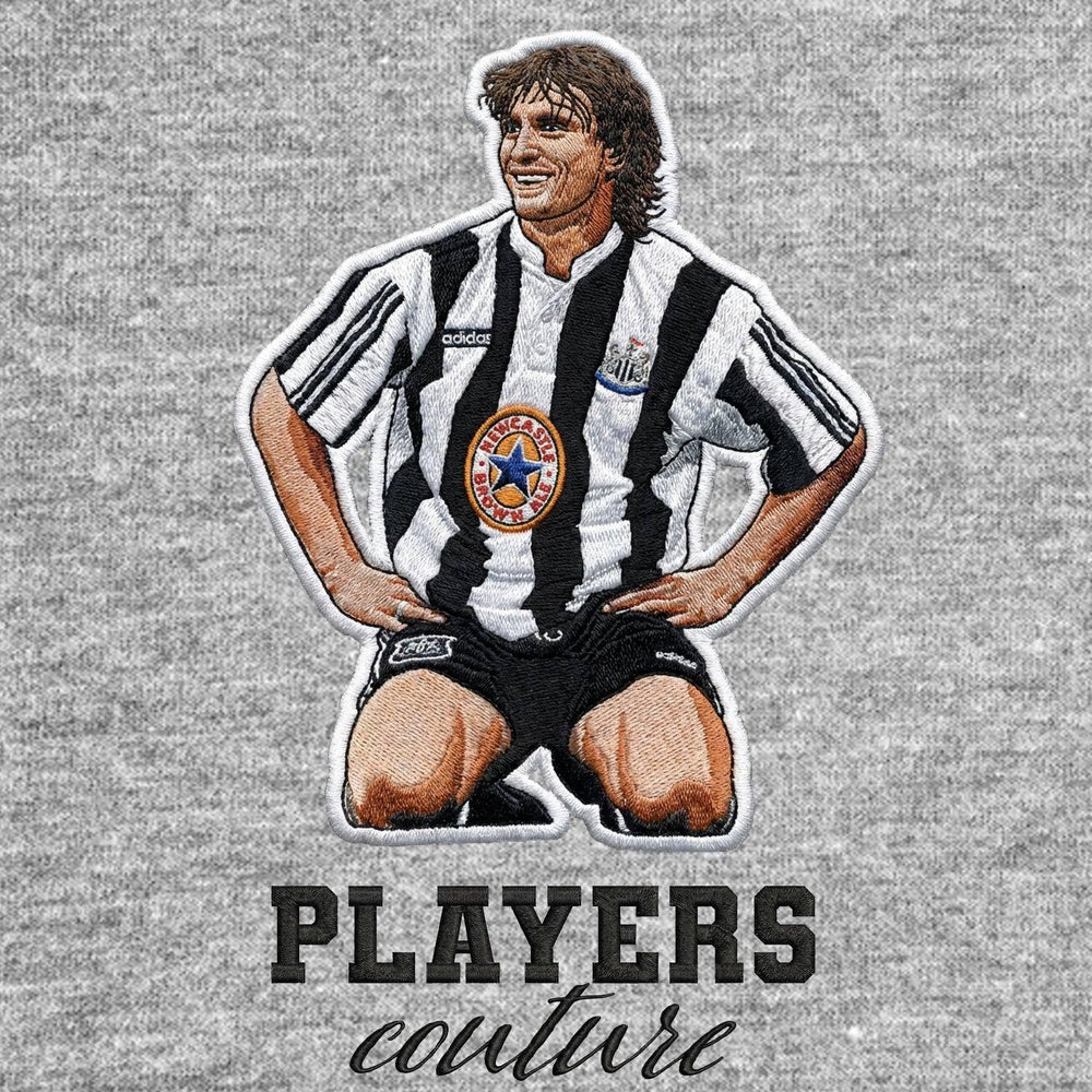 David Ginola Newcastle Badge Men's Hoodie – close-up detail shot of the David Ginola Newcastle Players Couture logo design