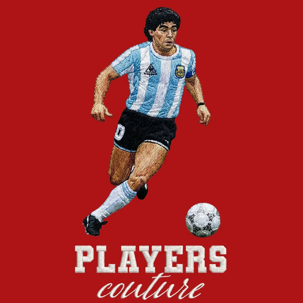 Diego Maradona Dribble Badge Men's Hoodie – red close-up detail shot of the Diego Maradona Dribble Players Couture logo