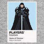 Jon Snow Jon Snow in black Night's Watch cloak carrying Longclaw beneath falling snow Icon Frame artwork in grey