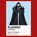 Jon Snow Jon Snow in black Night's Watch cloak carrying Longclaw beneath falling snow Icon Frame artwork in red