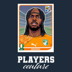 Gervinho World Cup Sticker Men's T-Shirt – navy close-up detail shot of the Gervinho World Cup Players Couture logo design