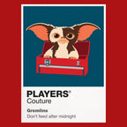 Gremlins Gizmo beside the mischievous Gremlins under Christmas lights in Kingston Falls Icon Frame artwork in red