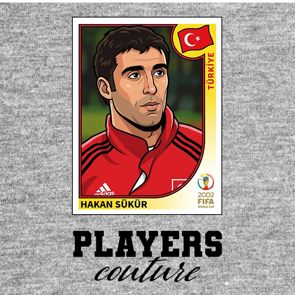 Hakan Sukur World Cup Sticker Men's T-Shirt – grey close-up detail shot of the Hakan Sukur World Cup Players Couture logo