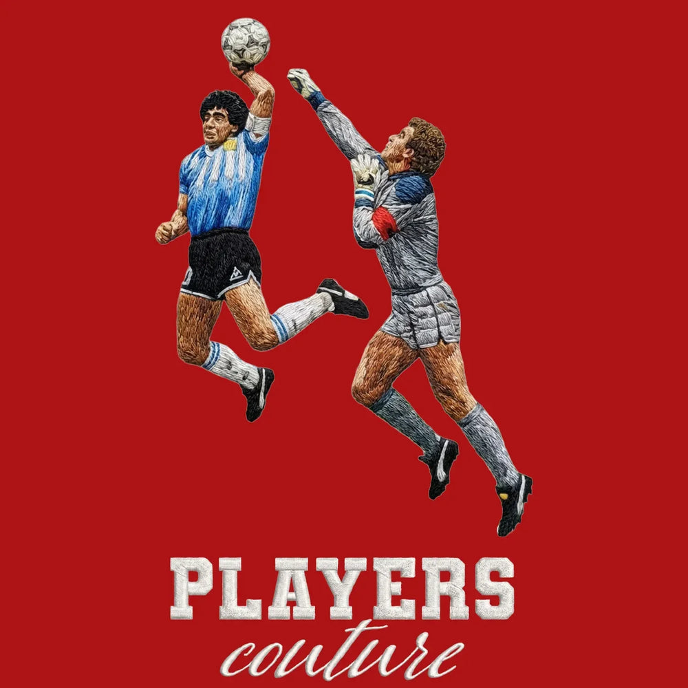 Maradona Hand of God Badge Men's T-Shirt – red close-up detail shot of the Maradona Hand of God Players Couture logo design