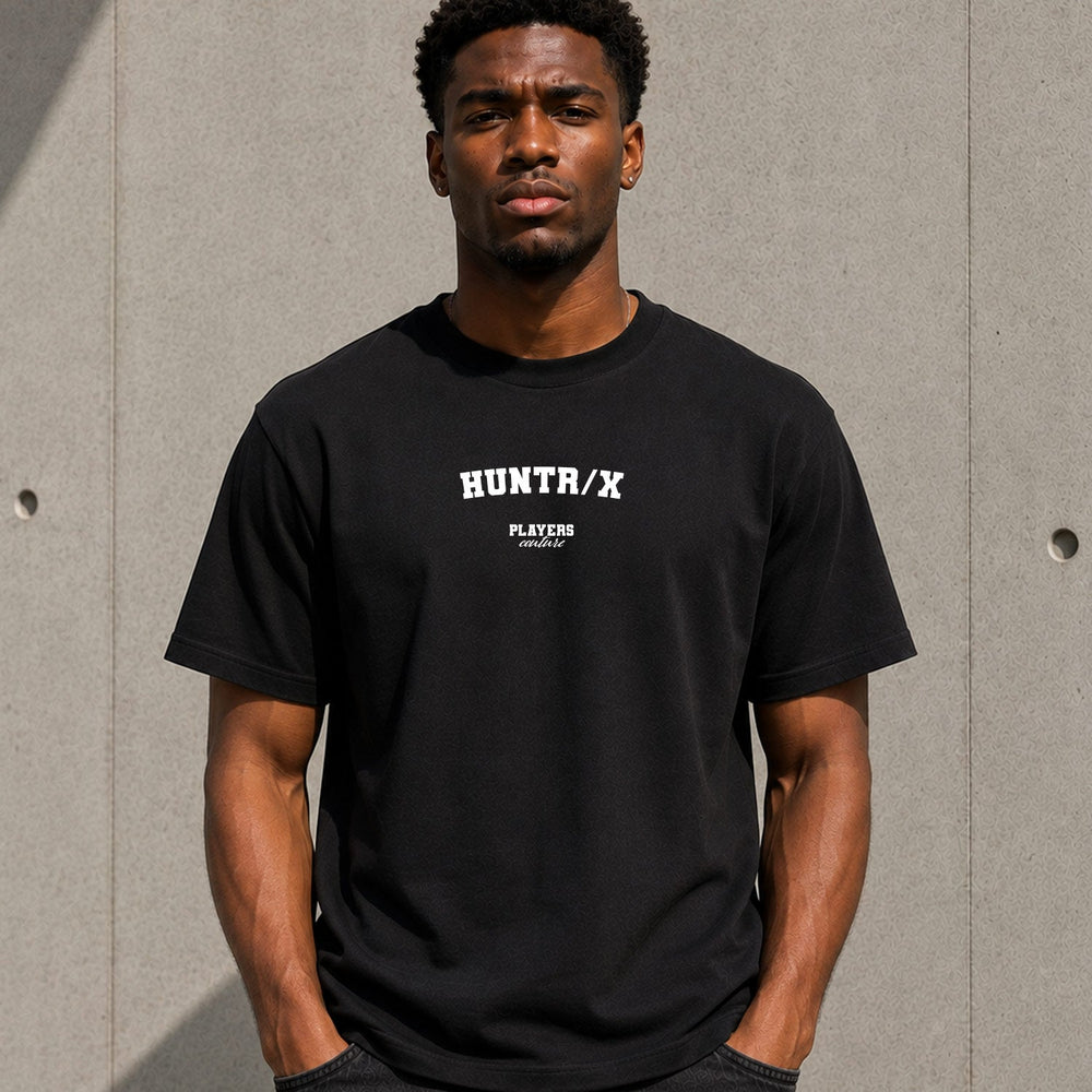 HUNTR/X Men's T-Shirt — lifestyle photo, Black t-shirt