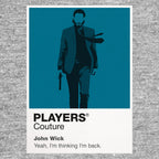 John Wick John Wick in black suit holding a pistol within the gold-lit architecture of the Continental Icon Frame artwork in grey