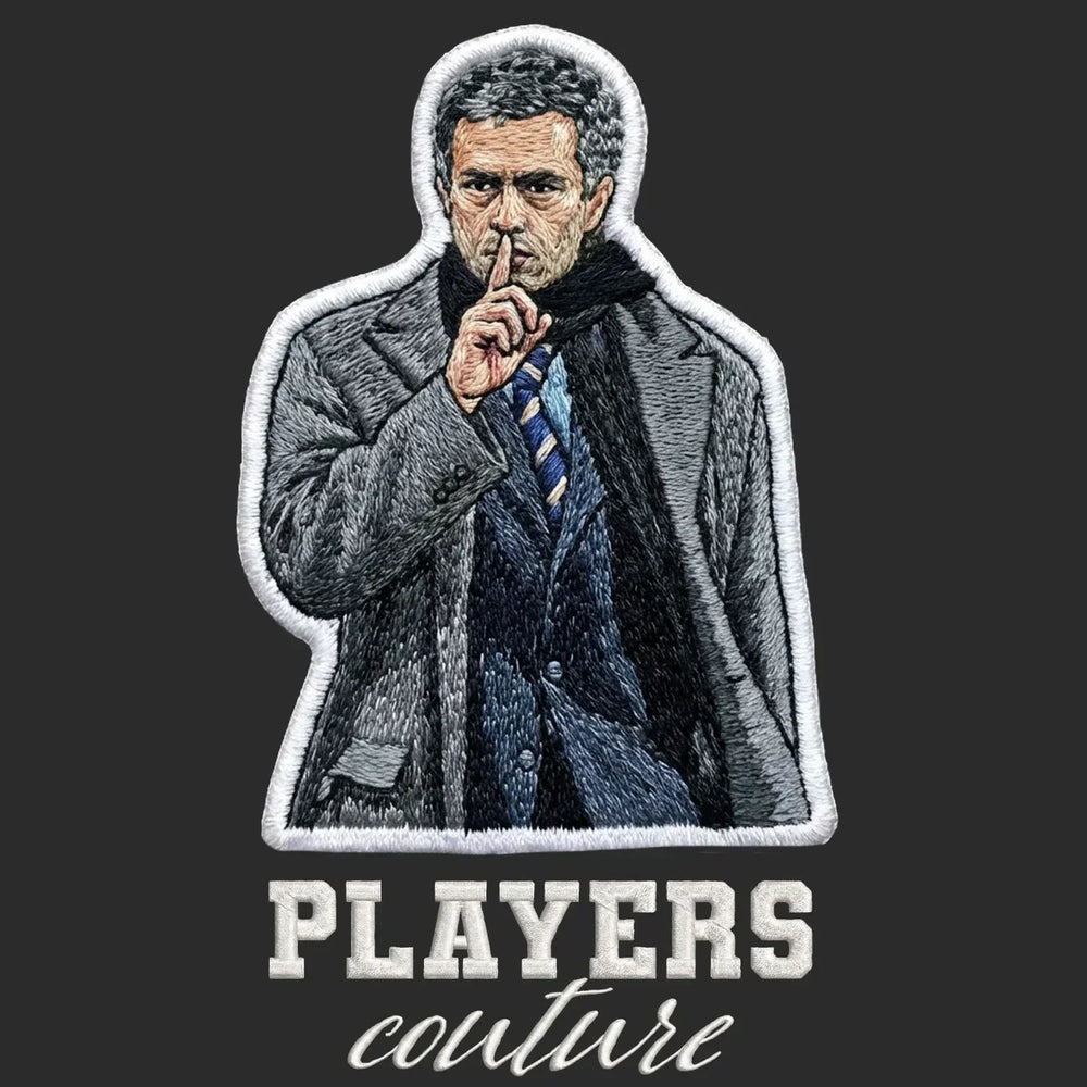 Jose Mourinho Badge Men's Hoodie – black close-up detail shot of the Jose Mourinho Players Couture logo design