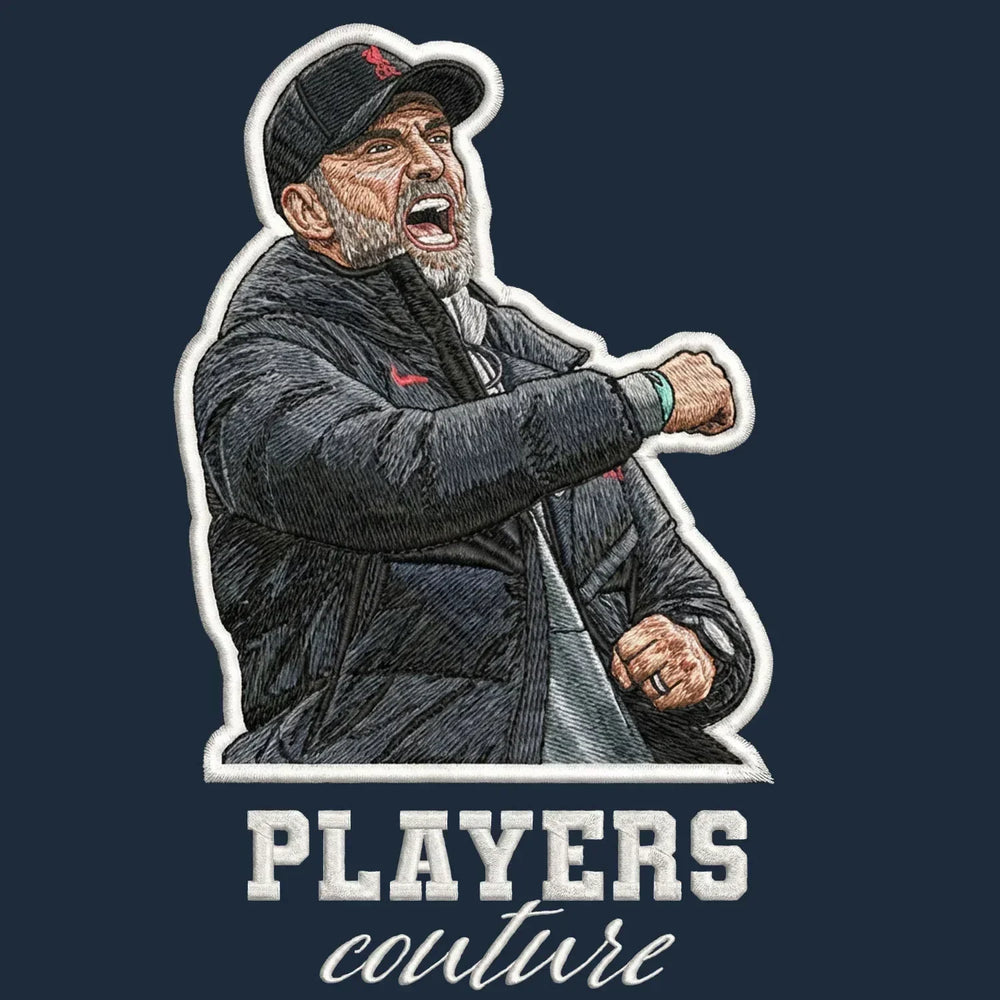Jurgen Klopp Celebration Badge Men's Hoodie – navy close-up detail shot of the Jurgen Klopp Celebration Players Couture logo