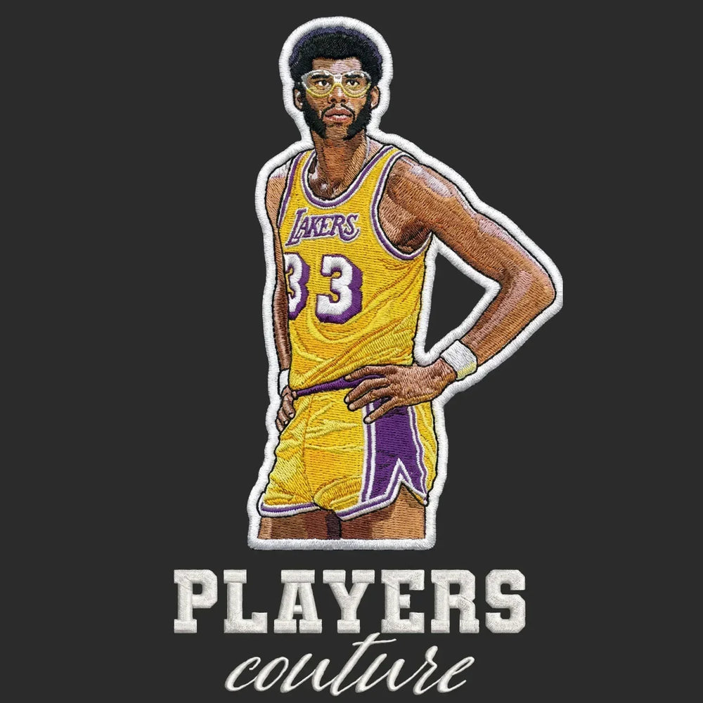 Kareem Abdul Jabbar Badge Men's Hoodie – black close-up detail shot of the Kareem Abdul Jabbar Players Couture logo design