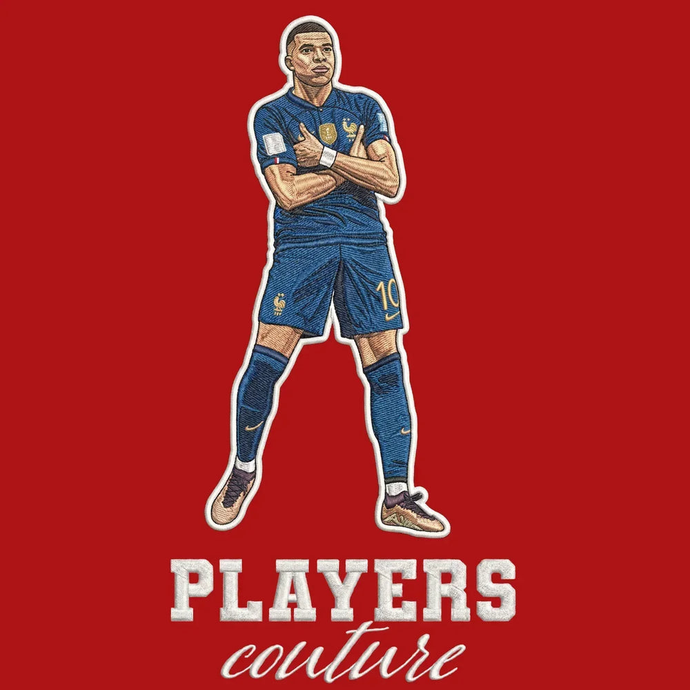 Kylian Mbappe Badge Men's Hoodie – red close-up detail shot of the Kylian Mbappe Players Couture logo design