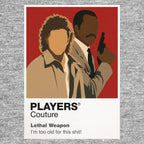 Lethal Weapon Riggs and Murtaugh standing back-to-back as mismatched Los Angeles detectives Icon Frame artwork in grey