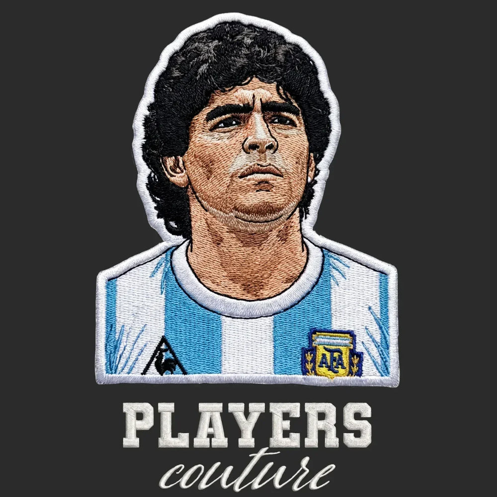 Diego Maradona Badge Men's Hoodie – black close-up detail shot of the Diego Maradona Players Couture logo design