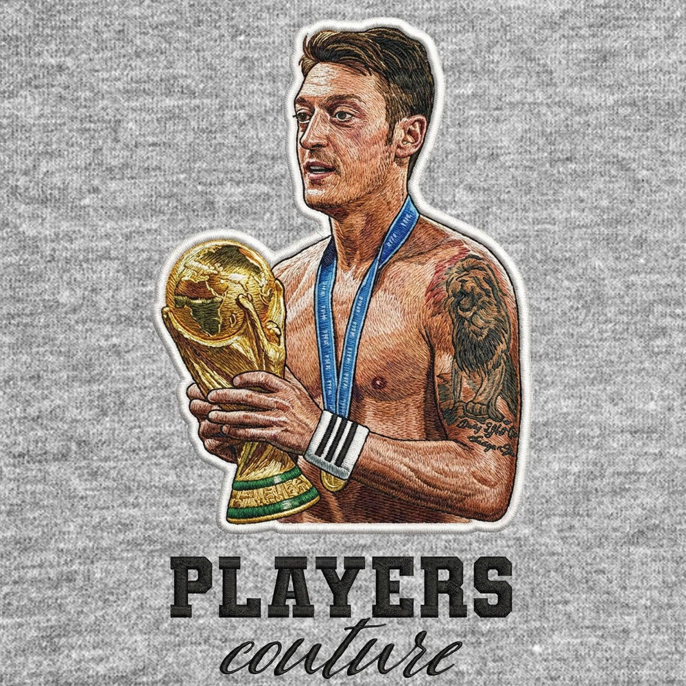 Mezut Ozil Badge Men's Hoodie – grey close-up detail shot of the Mezut Ozil Players Couture logo design