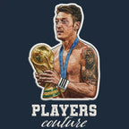 Mezut Ozil Badge Men's Hoodie – navy close-up detail shot of the Mezut Ozil Players Couture logo design