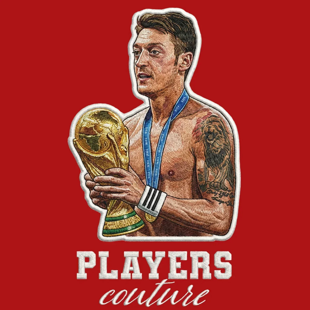 Mezut Ozil Badge Men's Hoodie – red close-up detail shot of the Mezut Ozil Players Couture logo design