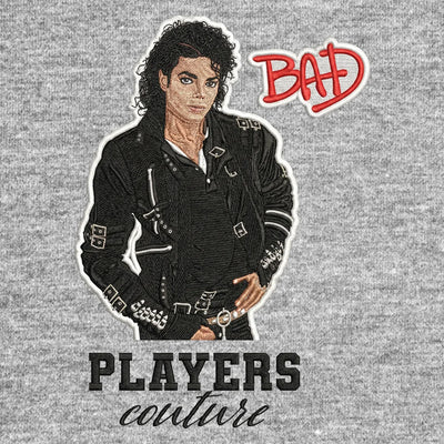 Michael Jackson Bad Badge Men's Hoodie – black close-up detail shot of the Michael Jackson Players Couture logo design
