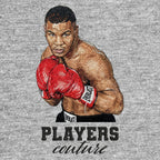 Mike Tyson Badge Men's Hoodie – black close-up detail shot of the Mike Tyson Players Couture logo design