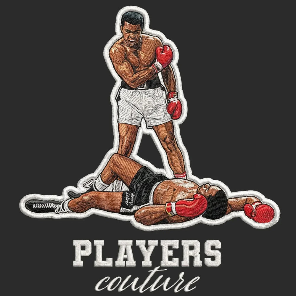 Muhammad Ali Badge Men's Hoodie – black close-up detail shot of the Muhammad Ali Players Couture logo design