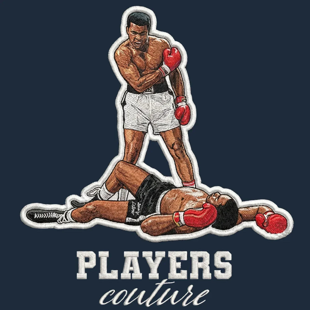 Muhammad Ali Badge Men's Hoodie – navy close-up detail shot of the Muhammad Ali Players Couture logo design