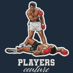 Muhammad Ali Badge Men's Hoodie – navy close-up detail shot of the Muhammad Ali Players Couture logo design