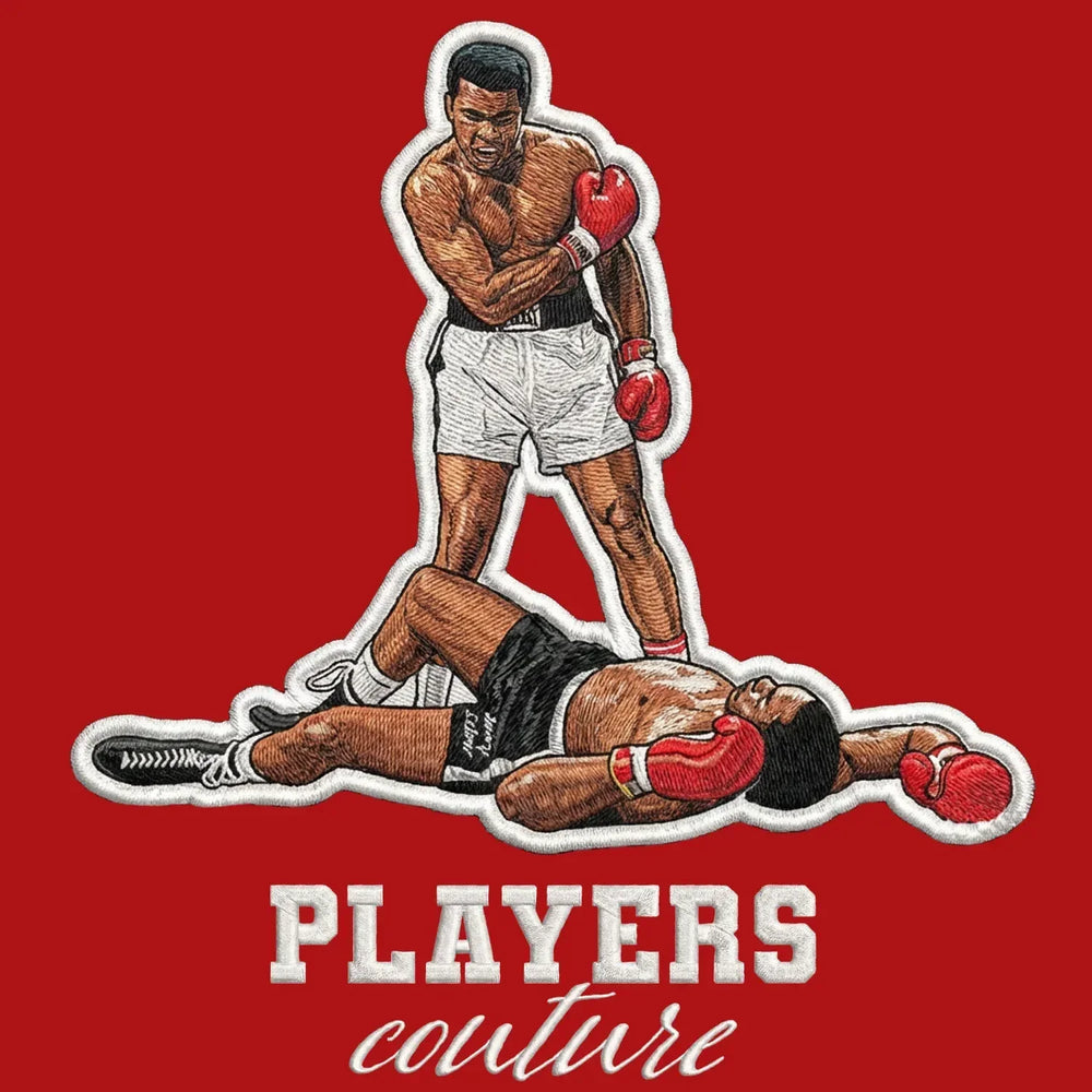 Muhammad Ali Badge Men's Hoodie – red close-up detail shot of the Muhammad Ali Players Couture logo design