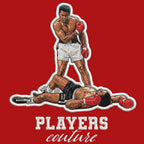 Muhammad Ali Badge Men's Hoodie – red close-up detail shot of the Muhammad Ali Players Couture logo design