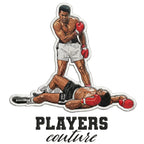 Muhammad Ali Badge Men's Hoodie – white close-up detail shot of the Muhammad Ali Players Couture logo design