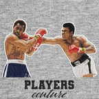 Muhammad Ali Punch Badge Men's Hoodie – grey close-up detail shot of the Muhammad Ali Punch Players Couture logo design