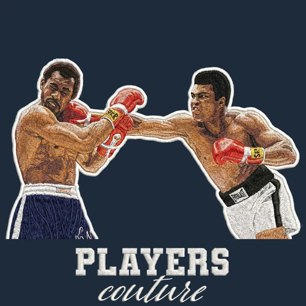Muhammad Ali Punch Badge Men's Hoodie – navy close-up detail shot of the Muhammad Ali Punch Players Couture logo design