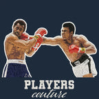 Muhammad Ali Punch Badge Men's Hoodie – navy close-up detail shot of the Muhammad Ali Punch Players Couture logo design