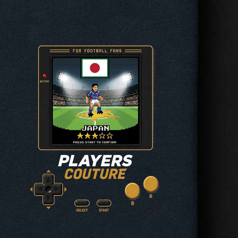 Vintage-style video game console with a screen displaying a soccer player and Japan's flag, on a dark background.