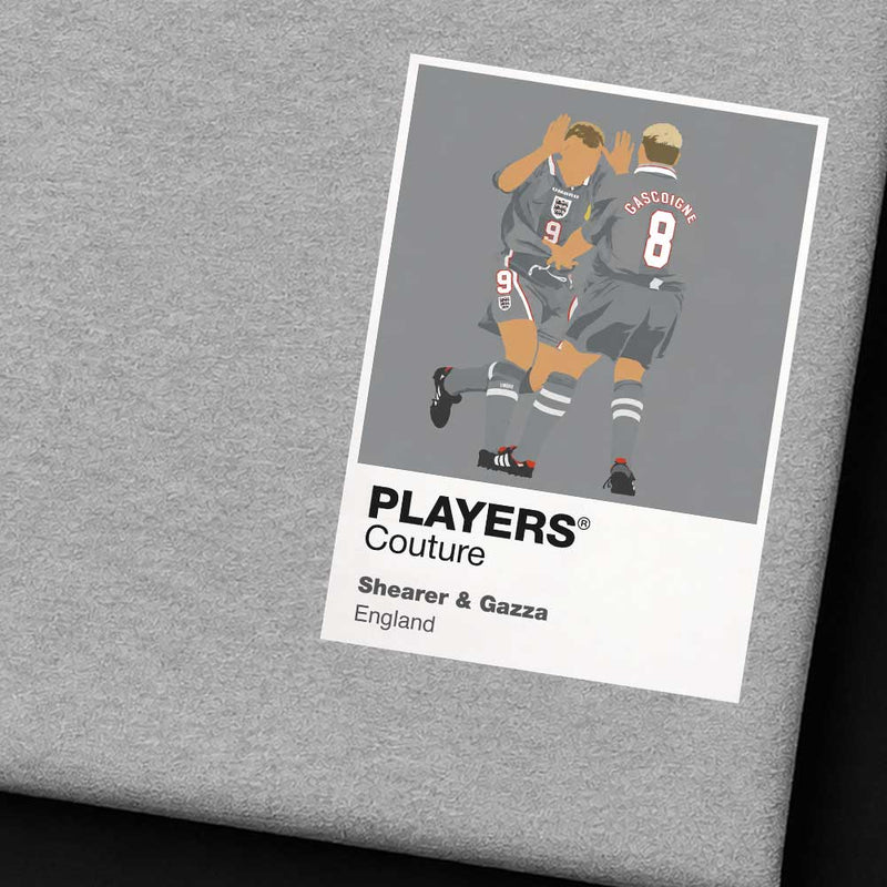 Gray fabric with a 'PLAYERS Couture' label featuring two soccer players on a white background.