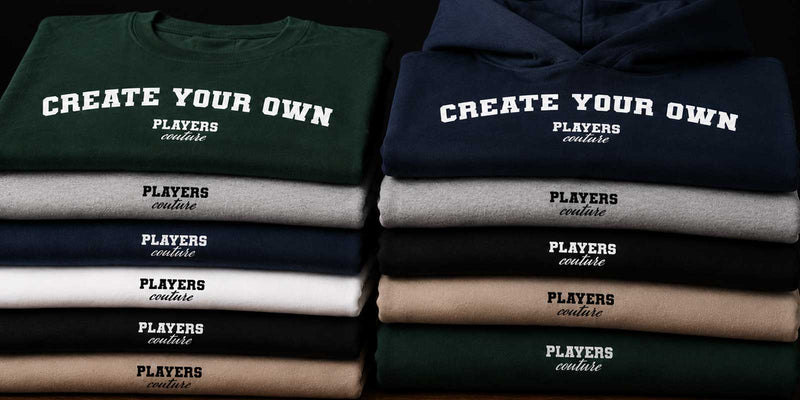 Stack of customizable t-shirts with text 'CREATE YOUR OWN' and 'PLAYERS Couture' on a black background.